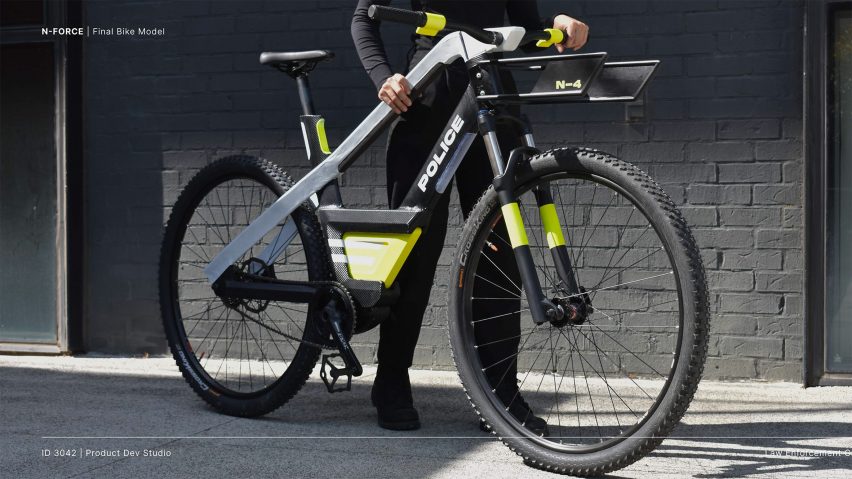 a black e-bile and a man holding the bike; the bike is designed by students at Georgia Institute of Technologies