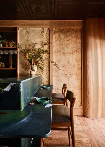 Burl wood veneer panels framed in white oak on the walls