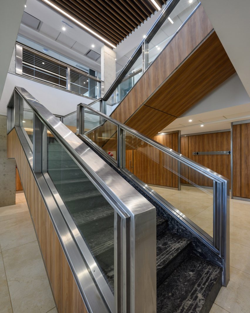 A large wooden staircase with metal railing