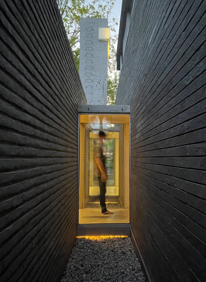 person standing in between entrance walls