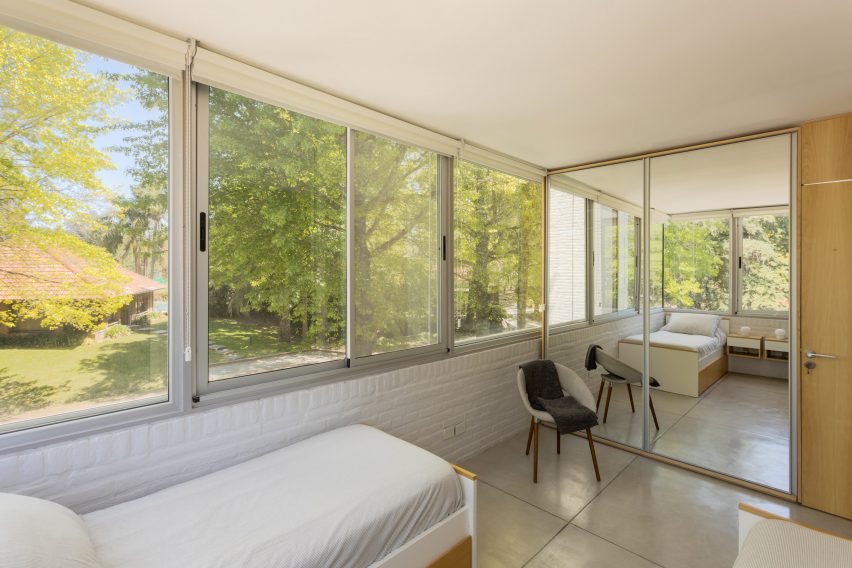 twin bed facing a mirror