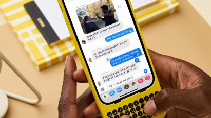 Person using iPhone with yellow keyboard by Clicks Technology