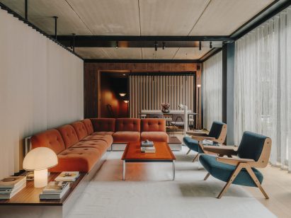 Living room-style space with an L-shaped sofa