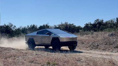 Still from Dezeen video of Tesla's Cybertruck being driven in a desert