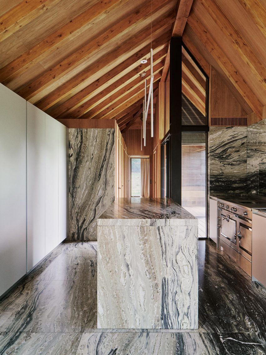 Barn-style kitchen interior with marble surfaces