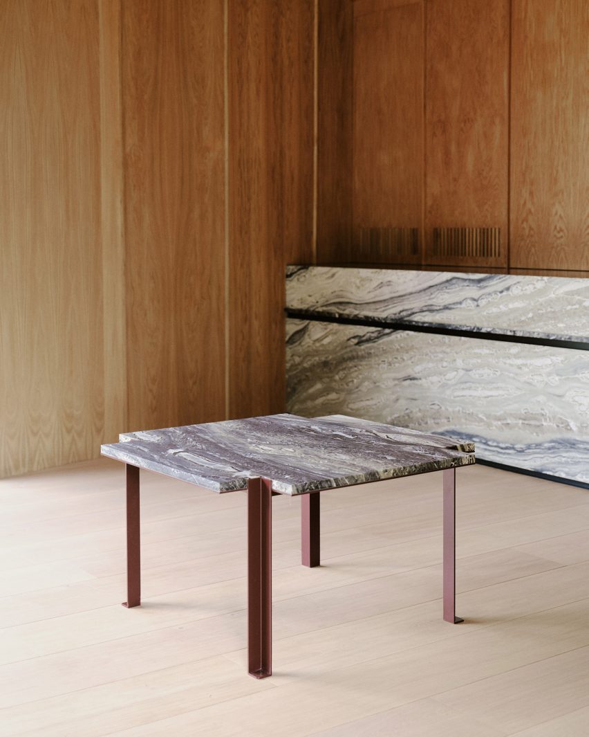 Marble table in a timber-lined interior