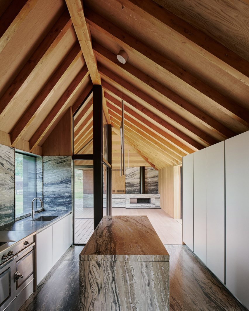 Barn-style kitchen interior with marble surfaces