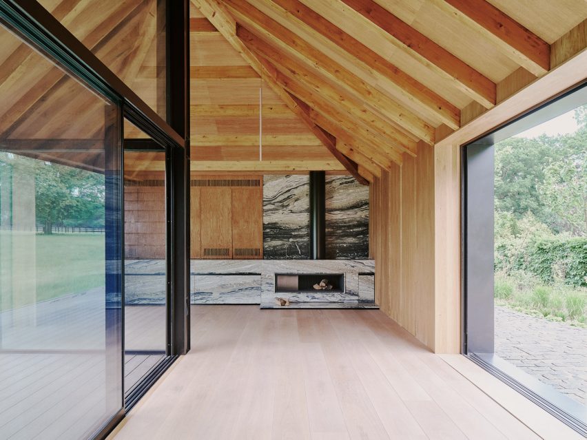 Barn-style interior with a marble fireplace