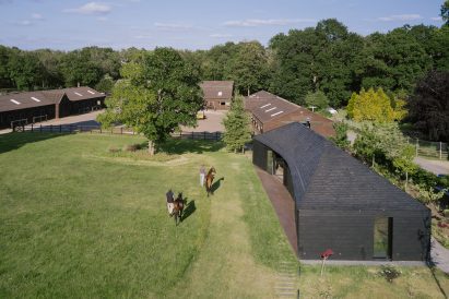 Exterior of clubhouse at Arc Polo Farm by DROO