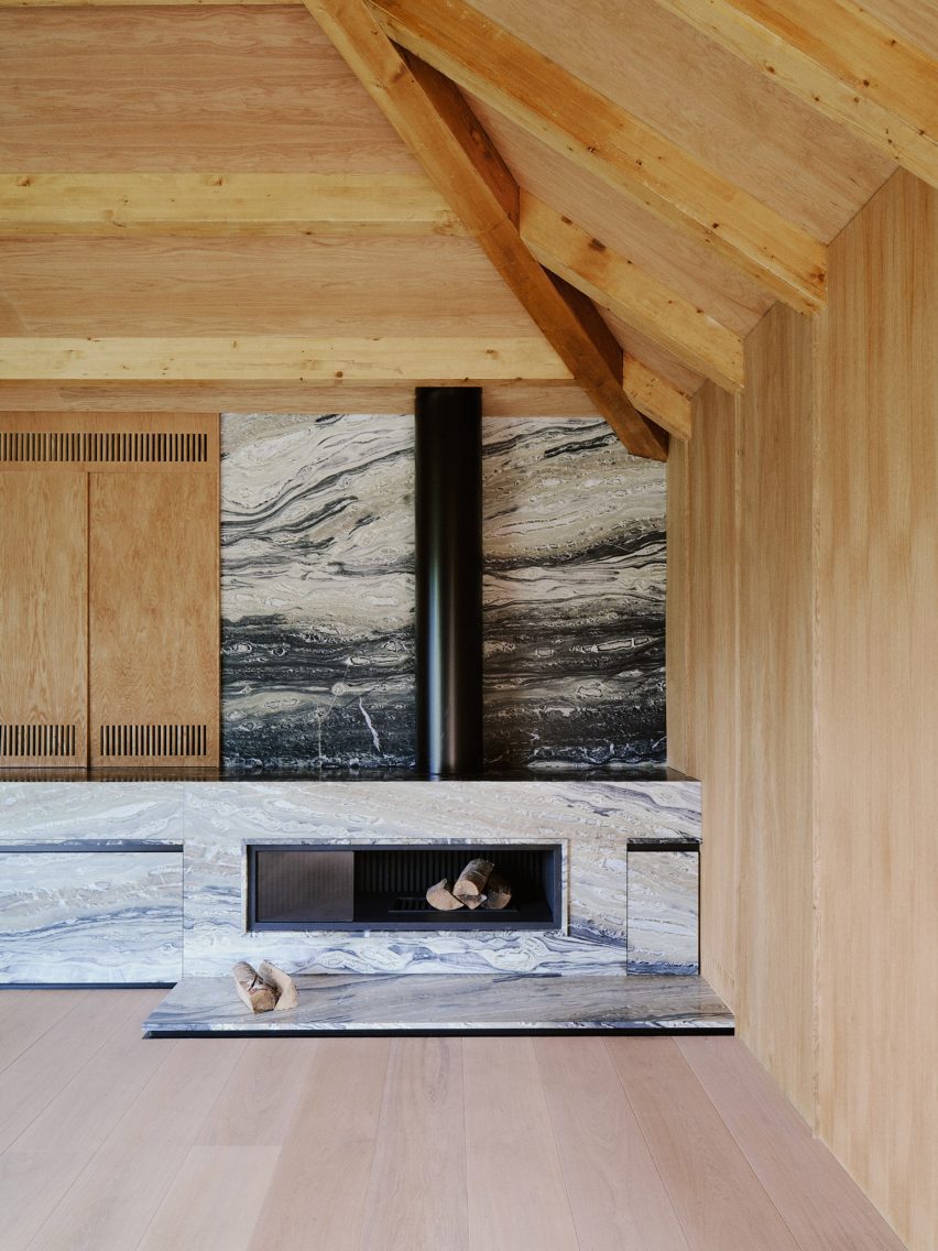Barn-style interior with a marble fireplace