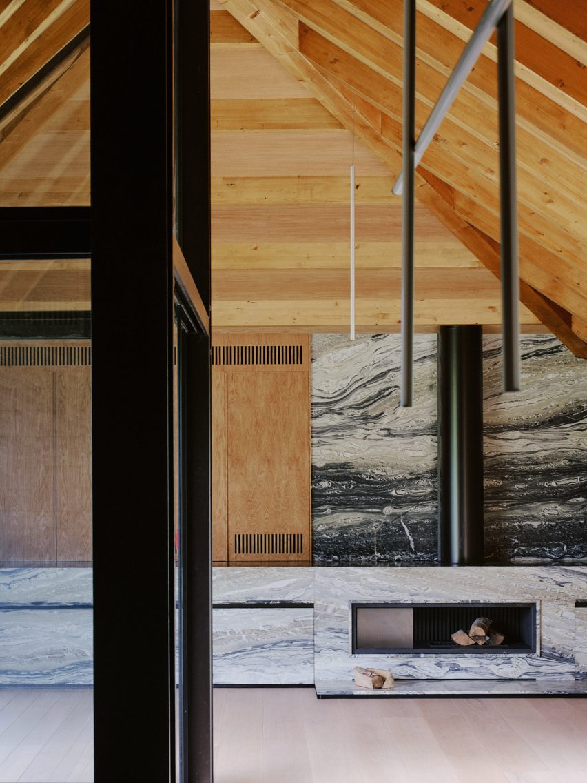 Barn-style interior with a marble fireplace