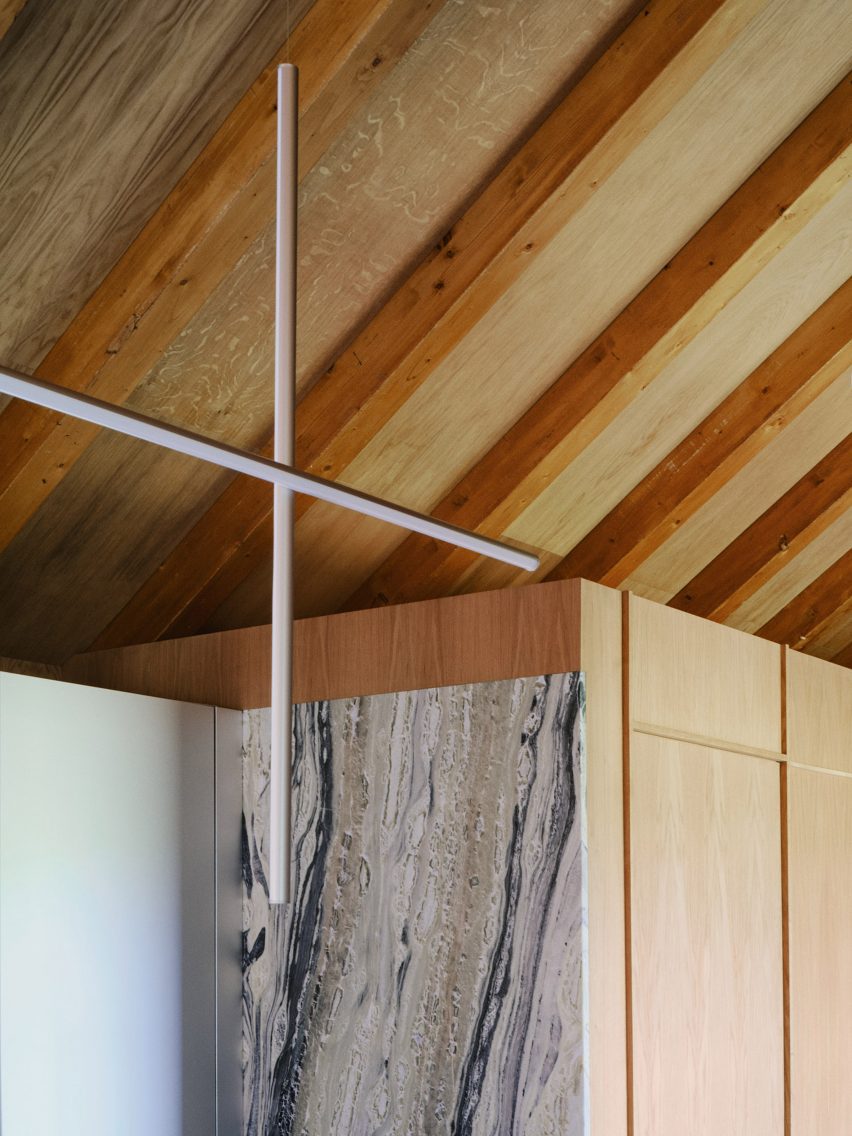 Barn-style interior with marble wall panelling
