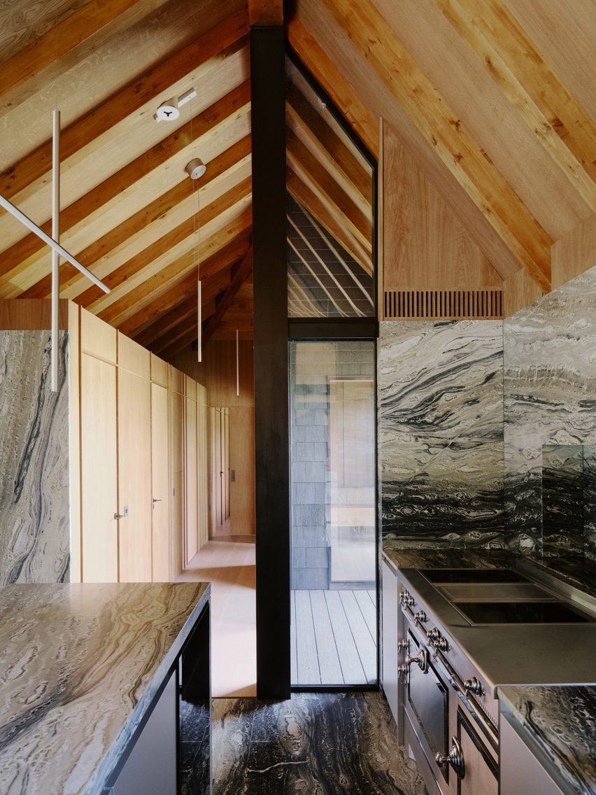 Barn-style kitchen interior with marble surfaces