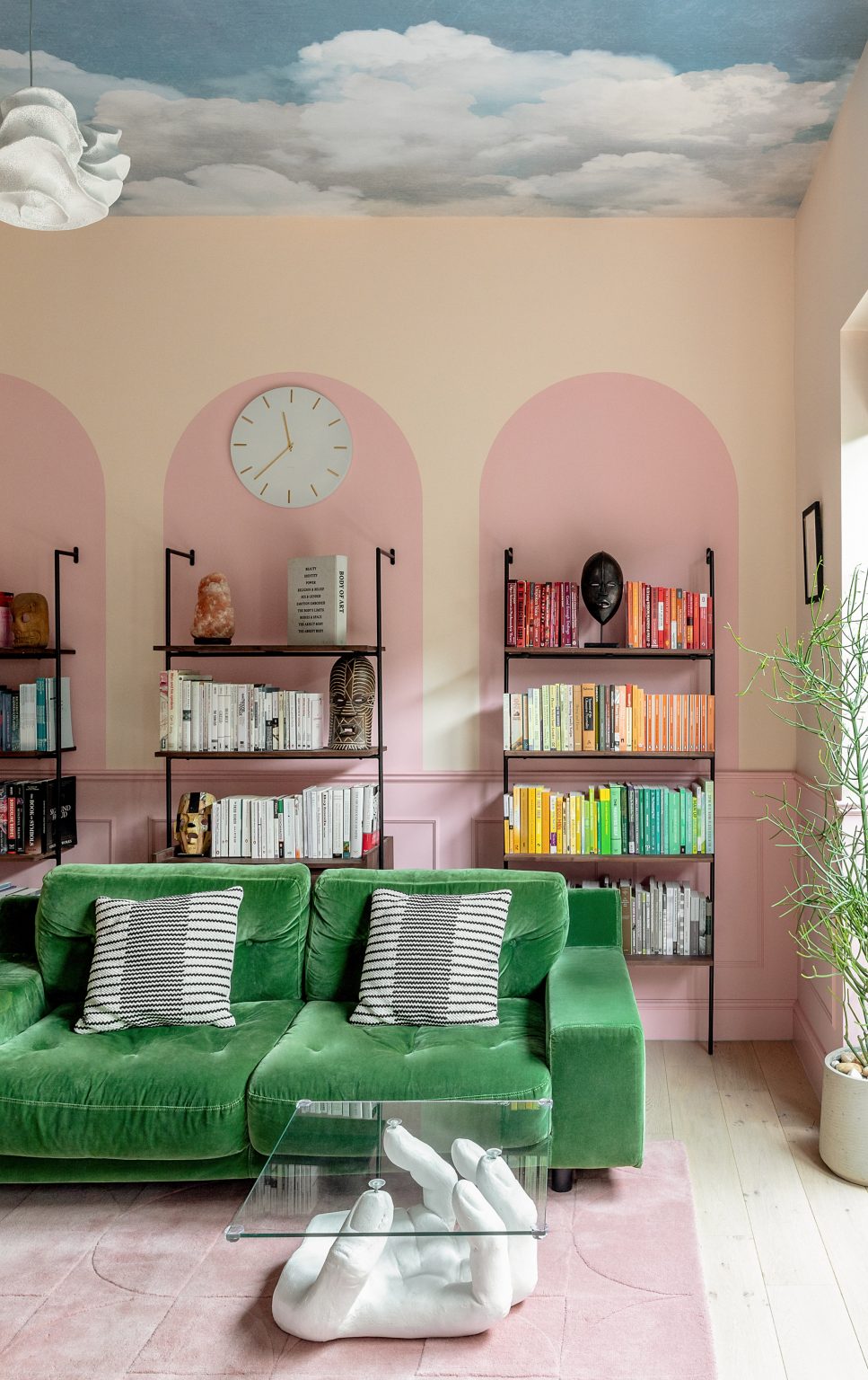 Pink wall graphics, green sofa and rainbow bookshelves in Moroccan-inspired townhouse by PL Studio
