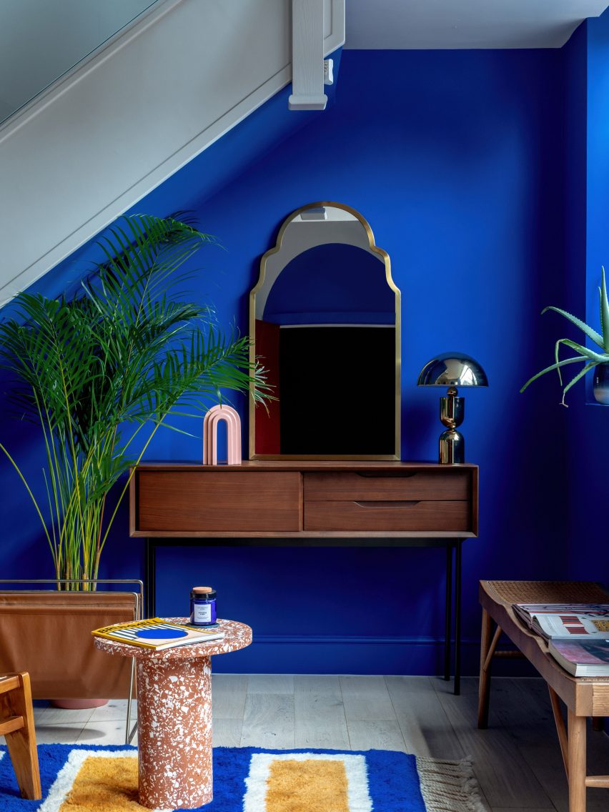 Blue wall and dresser in Moroccan-inspired townhouse by PL Studio