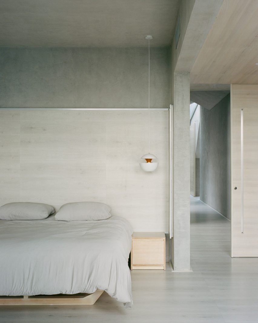 Bedroom with concrete wall