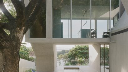 Glazed upper floor oversails swimming pool in FR House in the Philippines by CAZA