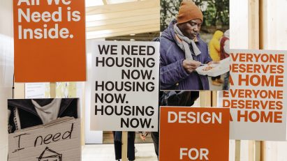 Picket signs with slogans related to homelessness
