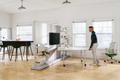 White desks in an open-plan office