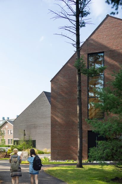 Bowdoin students next to Mills Hall