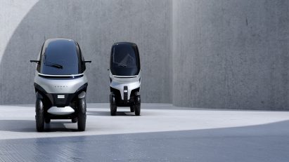 Rendering of the two types of Komma vehicle front-on, showing the narrow width