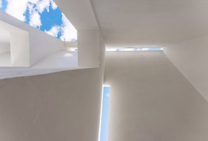 Angled walls and openings in Concrete Pavilion by Lin Architecture in rural China