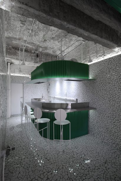 Curved bar with steel stools surrounding it