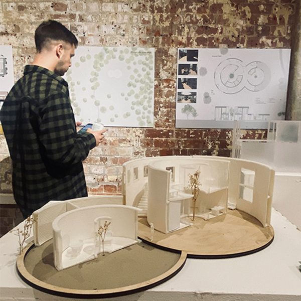a student visiting an exhibition of students' works at buckinghamshire new university