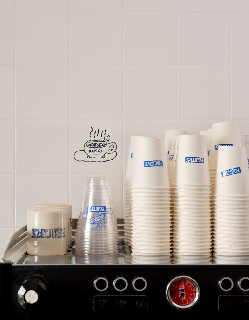 paper cups on top of espresso machine