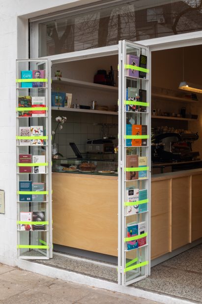 Open folding doors with books attached