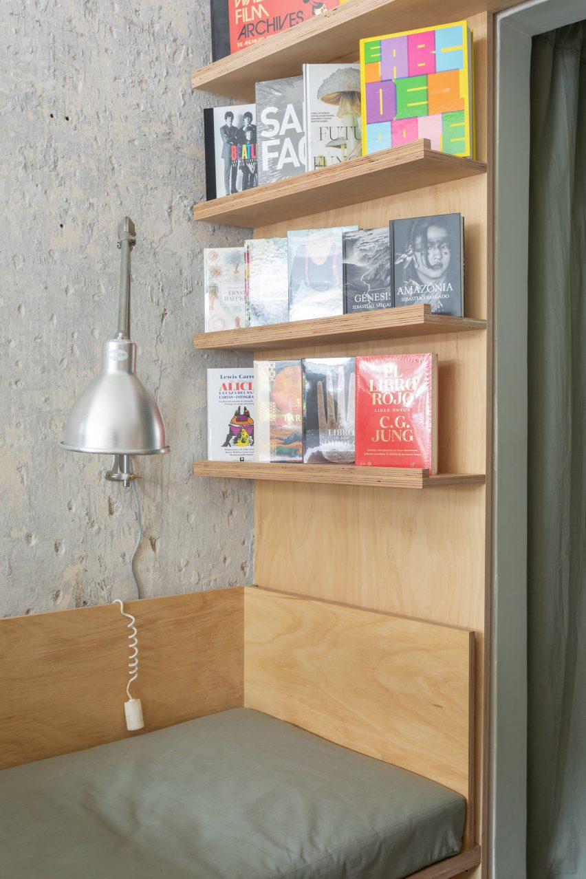 A corner with a couch and bookshelves
