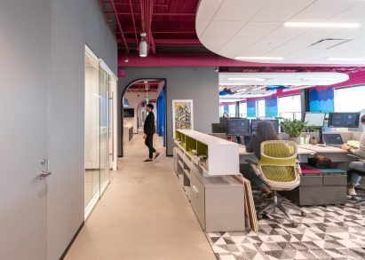 Desks and geometric carpet in self-designed studio