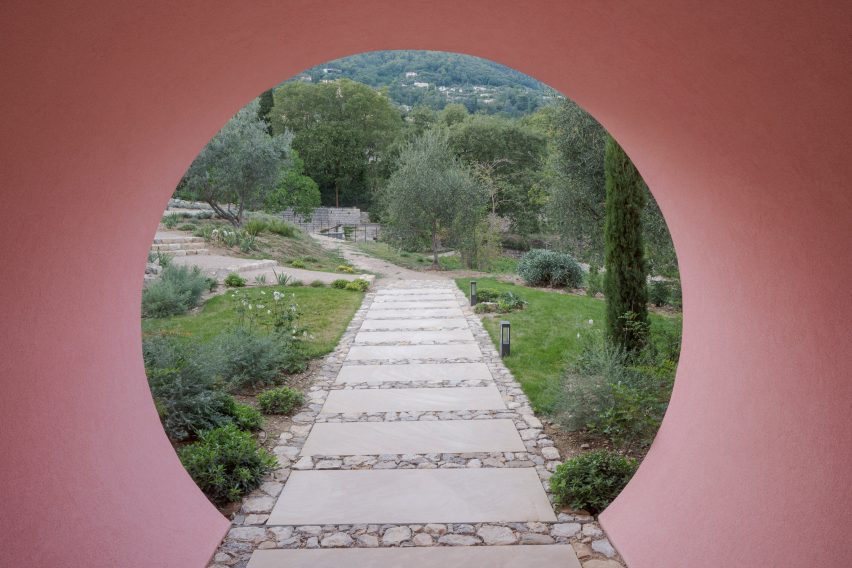 Circular opening through a pink building