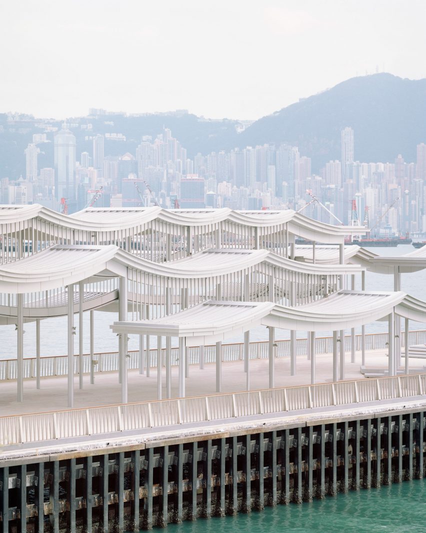 Promenade on a Hong Kong harbour with a curving steel canopy