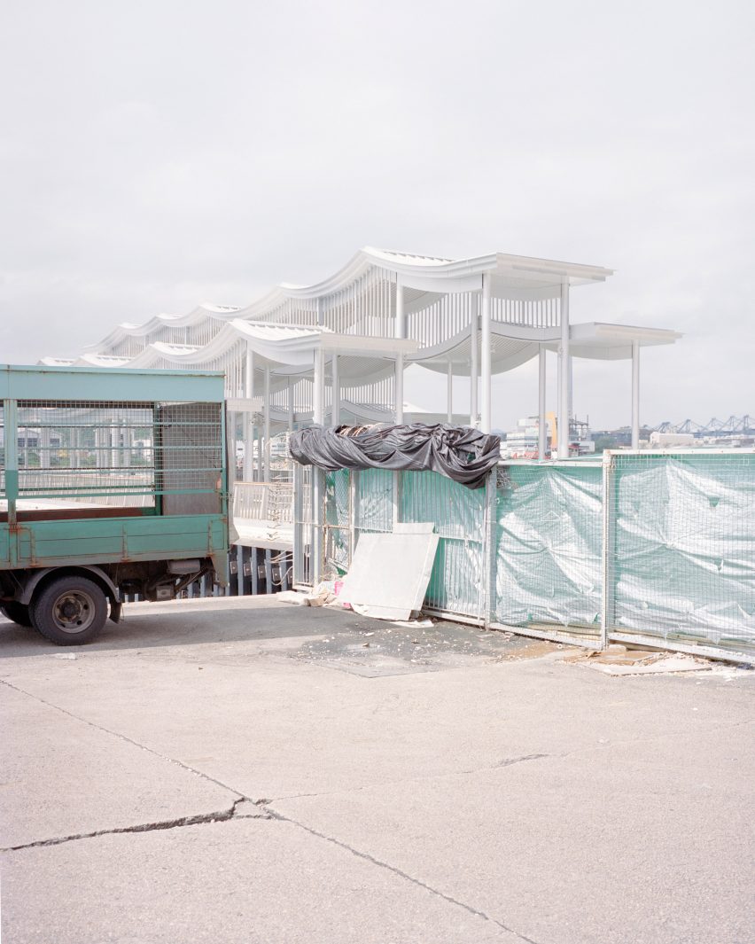 Promenade on a Hong Kong harbour with a steel canopy