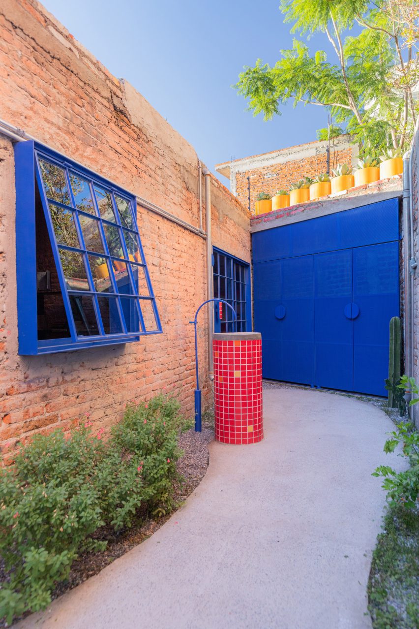bright blue window and door in an alley