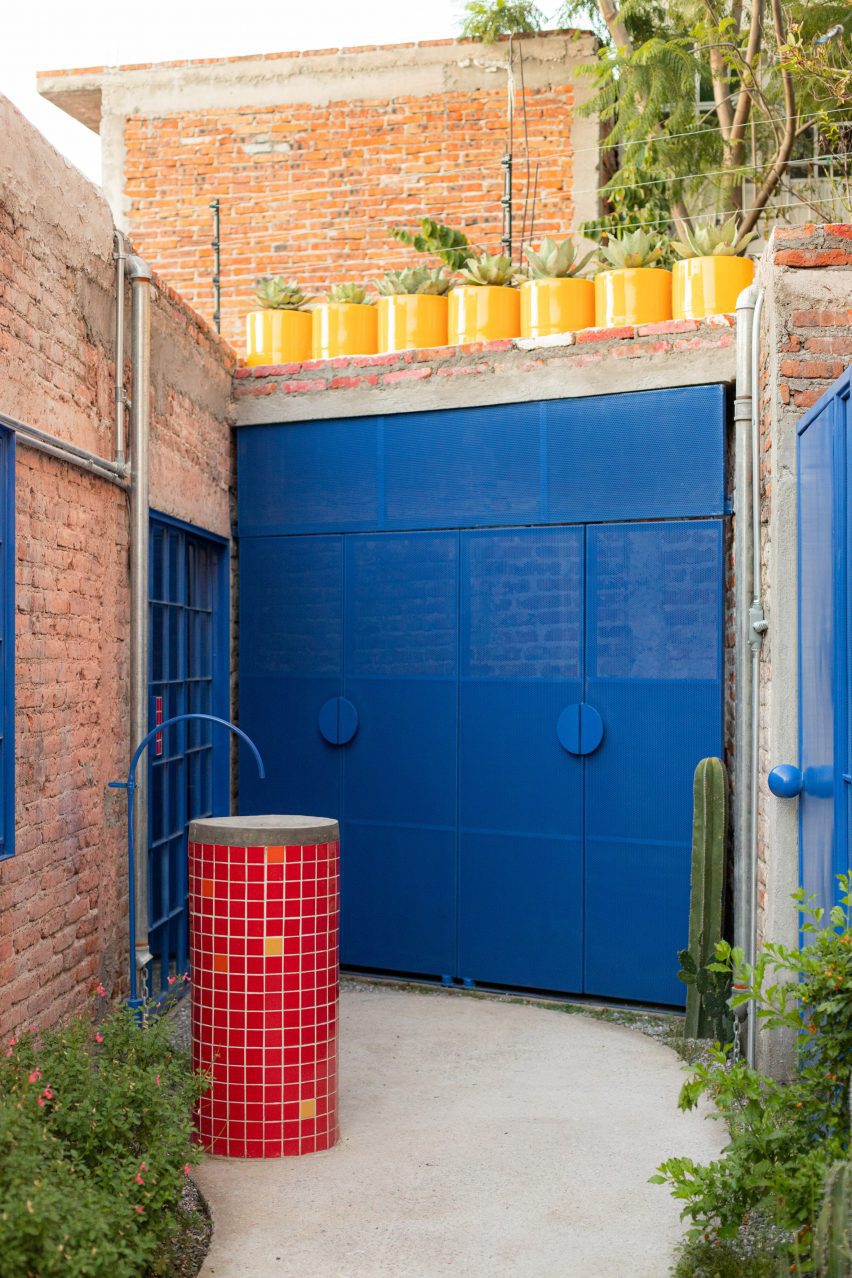 bright blue window and door in an alley