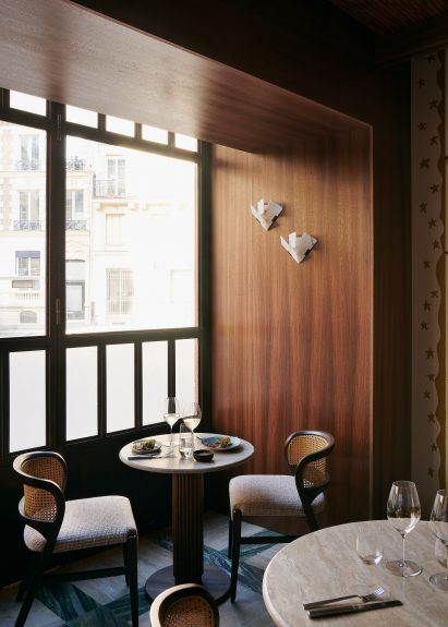 Tables and chairs in window of Fogo