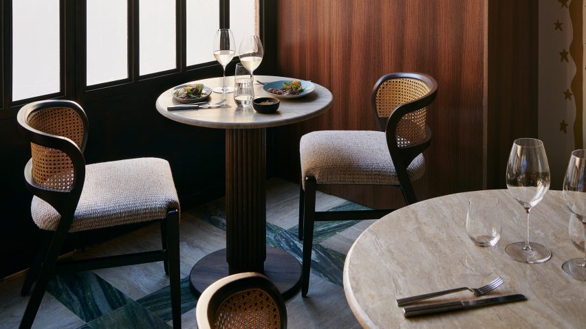 Tables and chairs in window of Fogo