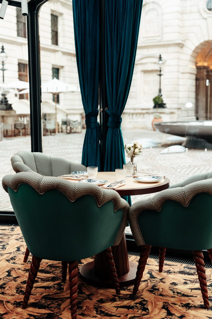 Blue tables and curtains of cafe at old war office pavilion