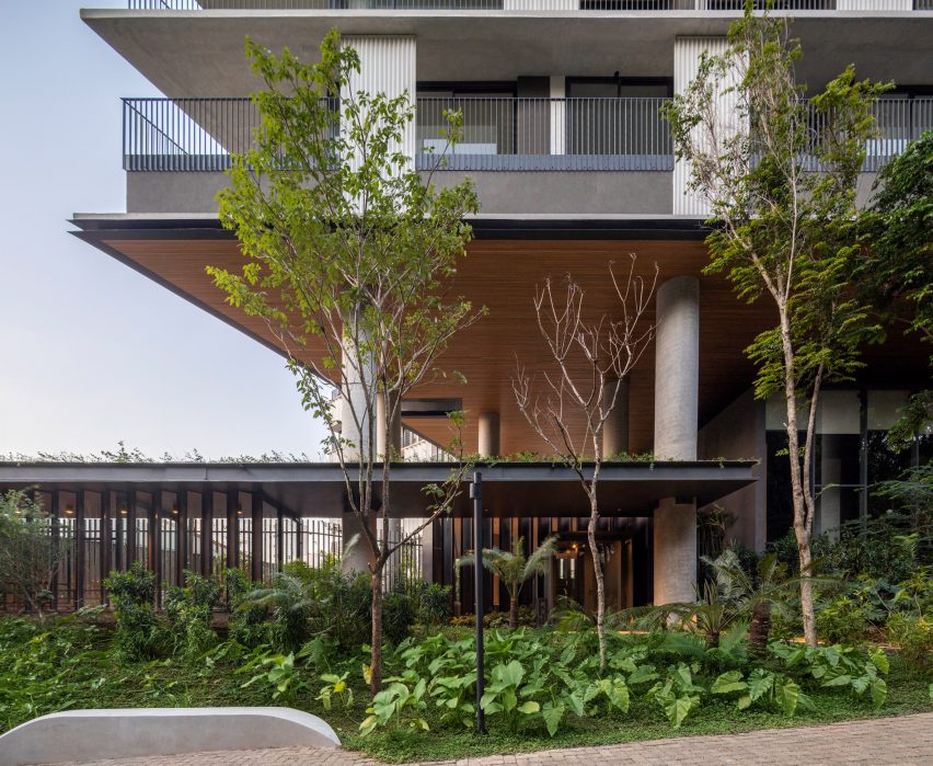 Landscape and pilotis of Onze22 tower by Triptyque