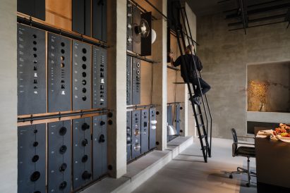 Library of materials inside lighting showroom by B-bis architecten