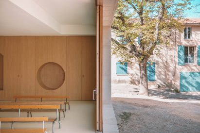 Classroom opened up to a courtyard at Auguste Benedict School