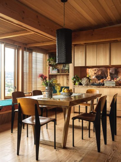 Wood-lined room with dining table and six chairs