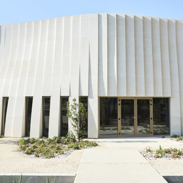 Rippling stone facade of Delas Frères Winery by Carl Fredrik Svenstedt Architect