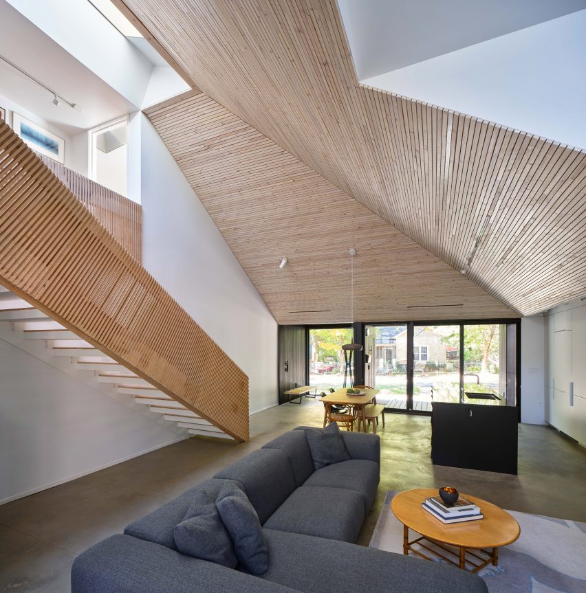 Living room with angled ceiling