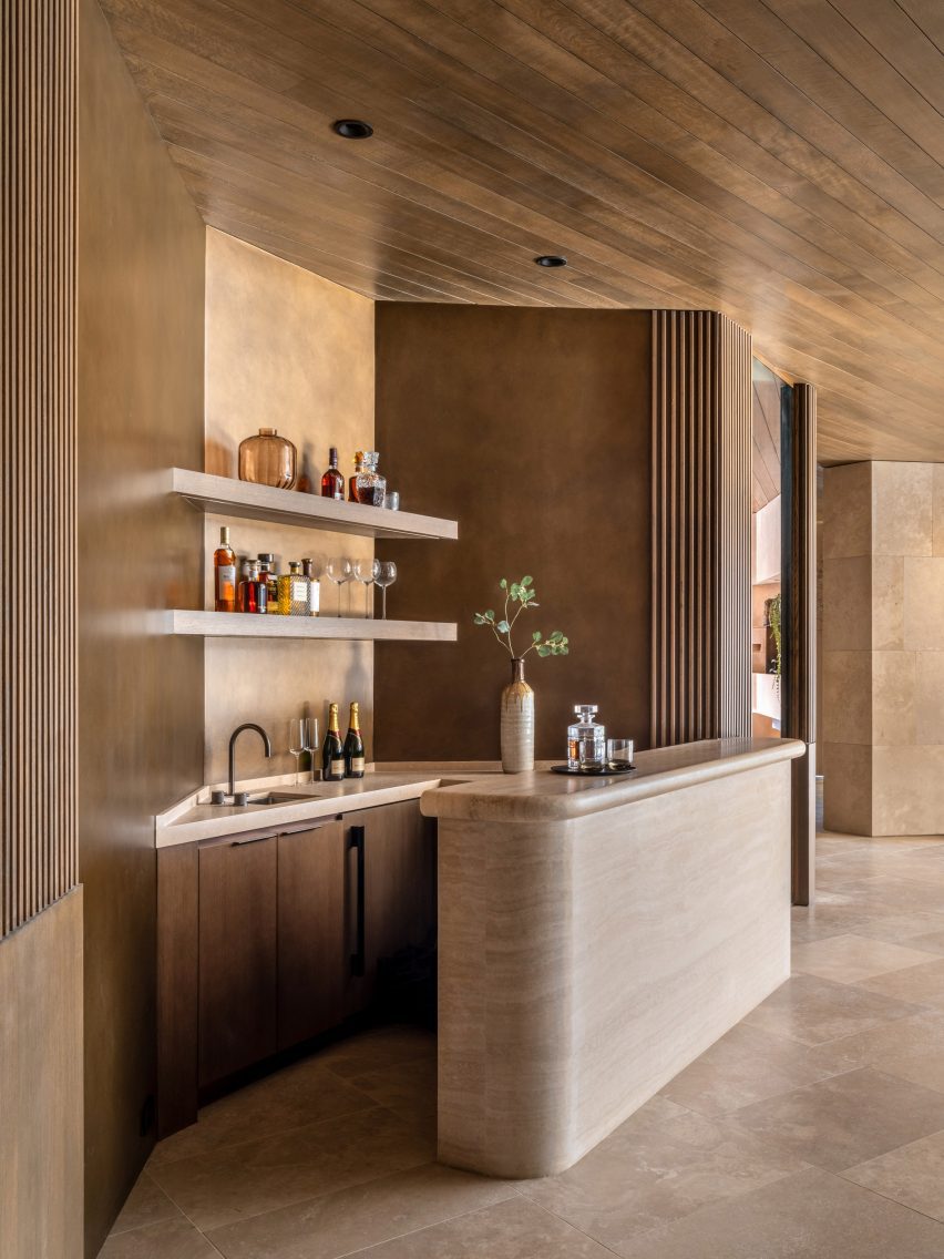 Kitchen clad in stone and wood
