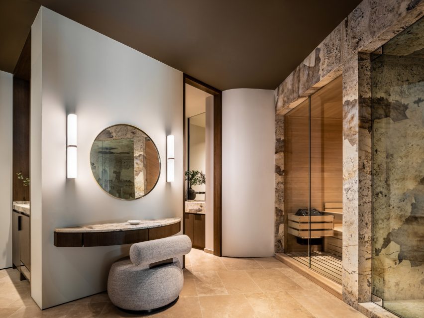 A bathroom with circular mirror