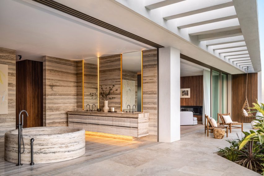 A bathroom aligned against a wall with open space in front