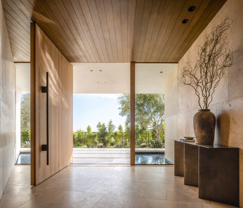 Entryway with large wood door